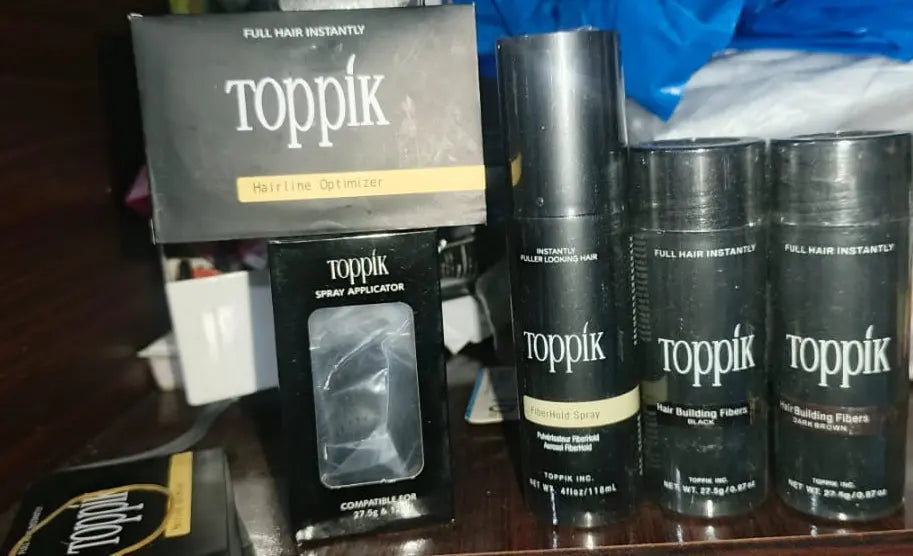 Toppik Hair Building Fiber 4-in-1 Combo Pack. This set includes Toppik Hair Fiber, Fiber Hold Spray, a Spray Applicator Pump, and a Hairline Optimizer Comb ZE Enterprises