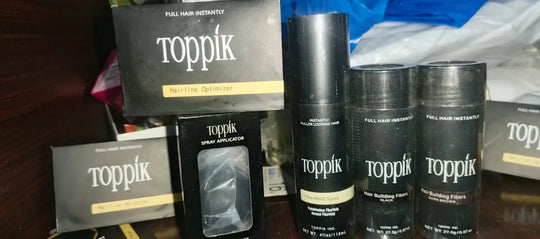 Toppik Hair Building Fiber 4-in-1 Combo Pack. This set includes Toppik Hair Fiber, Fiber Hold Spray, a Spray Applicator Pump, and a Hairline Optimizer Comb ZE Enterprises